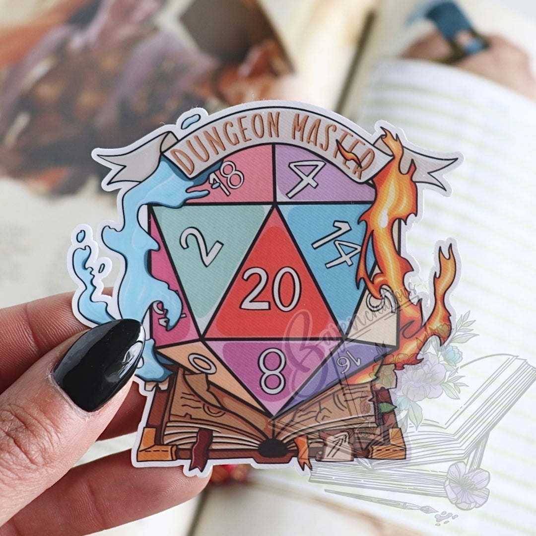 Sticker of a D20 dice with fantasy elements held by a hand.