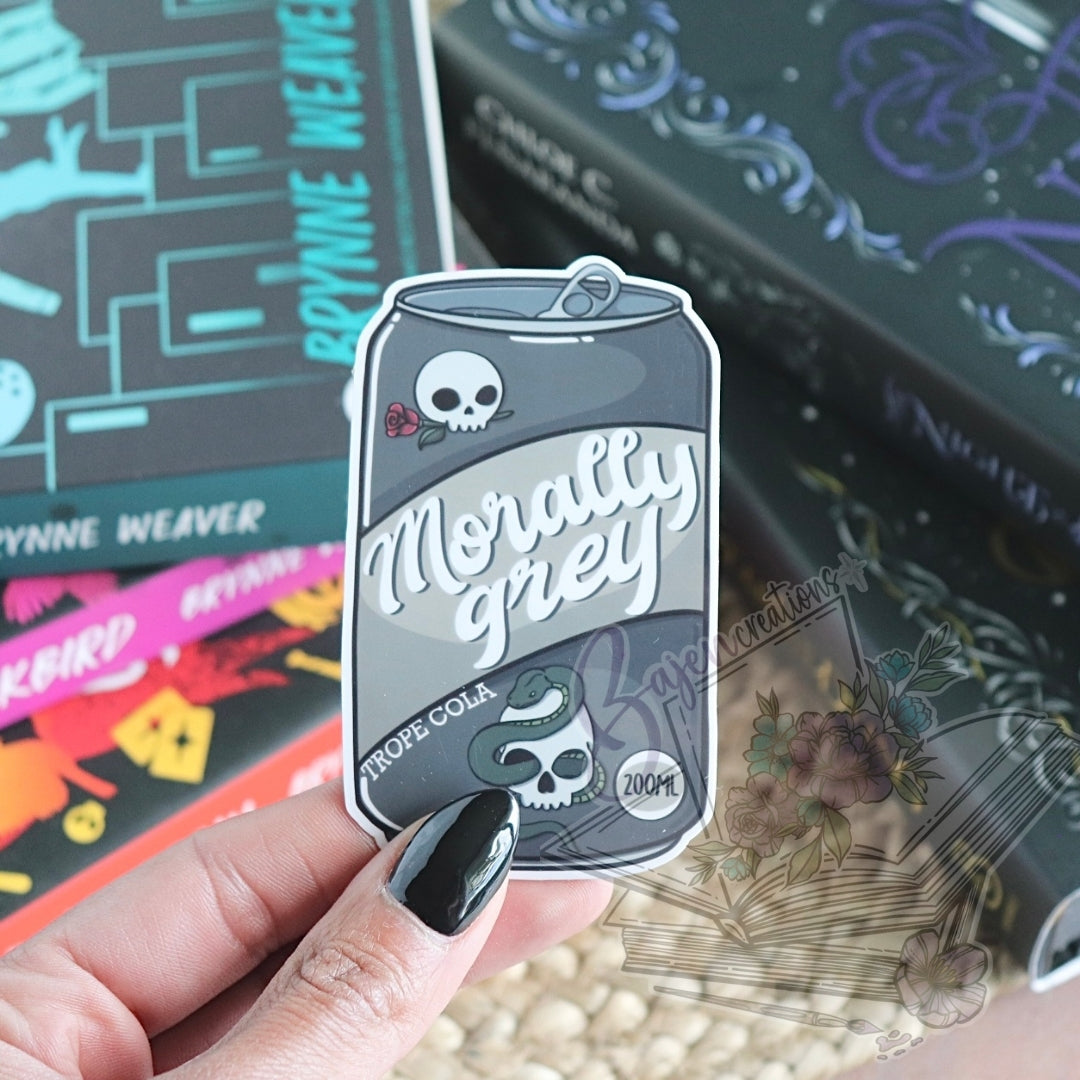 Sticker with 'Morally Grey' sticker held by a hand against a colorful background