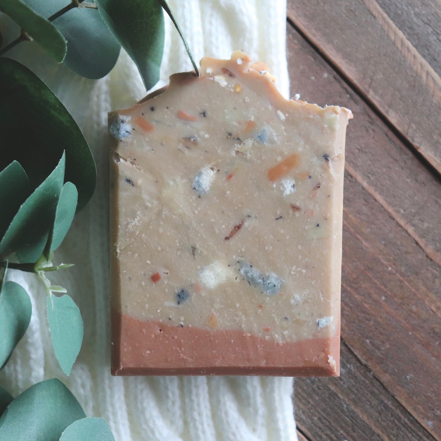 handcrafted soap bar with other soap pieces embedded to make the soap look sprinkled with confetti